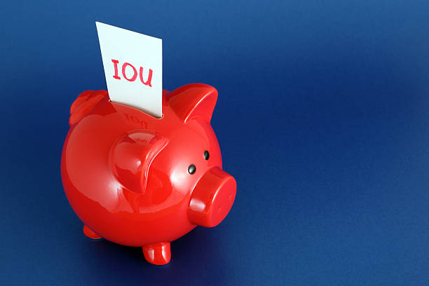 IOU Piggy Bank  borrowing stock pictures, royalty-free photos & images