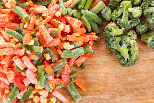 istock Frozen vegetables on wooden board 917420534
