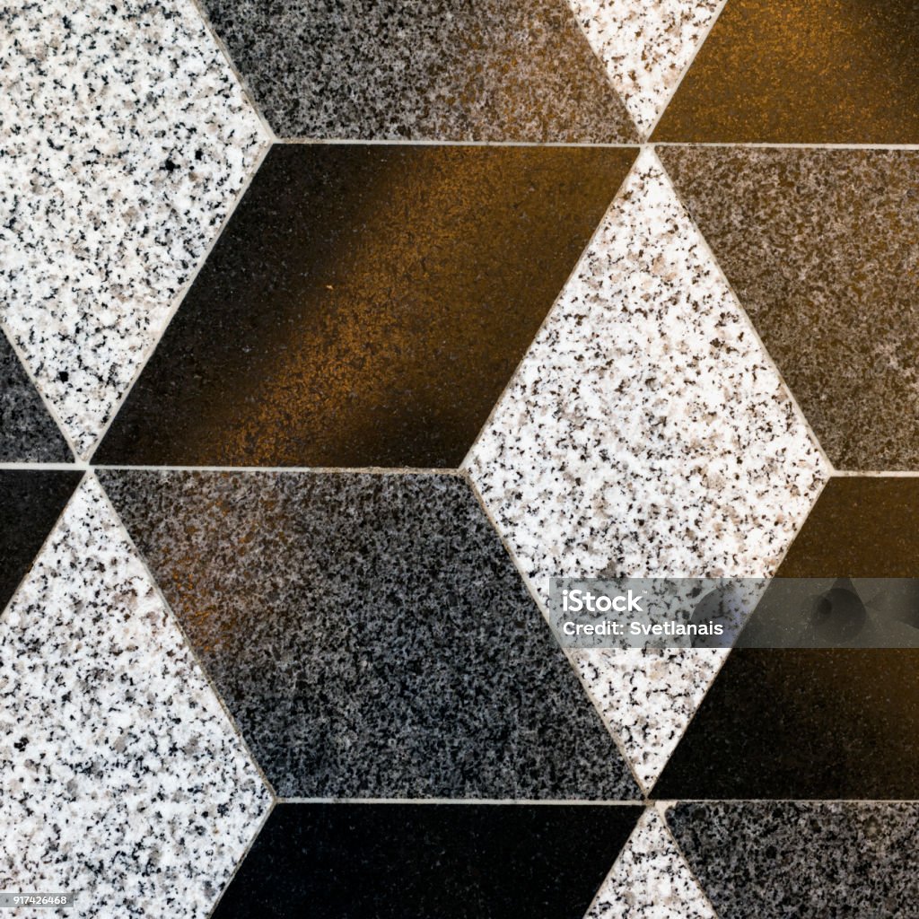 Part of mosaic rhombus ceramic floor tiles, background, texture Part of mosaic rhombus ceramic floor tiles, background, texture, beige and brown colors, square Abstract Stock Photo