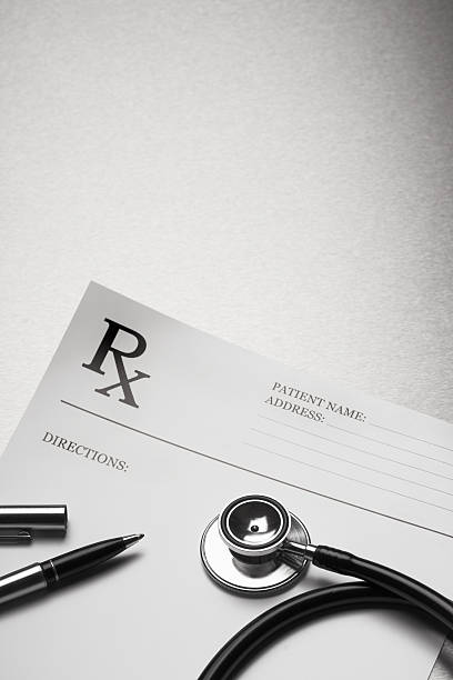 istock RX prescription form stethoscope and pen 91742662