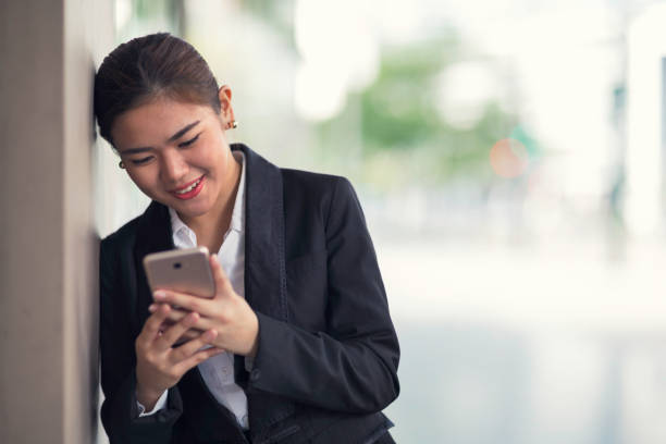 istock Woman reading on her mobile phone 917426740