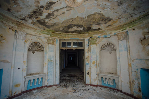 istock Old ruined abandoned mansion, interior of round hall 917428228