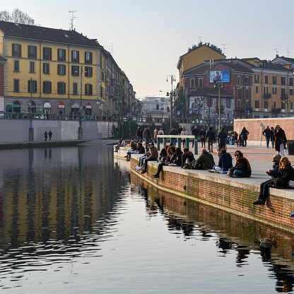 Milan, Italy - Feb 11, 2018: Darsena harbour is at the point where the Naviglio Pavese and Naviglio Grande canals meet. It was once an important node for water-borne transport and trade
