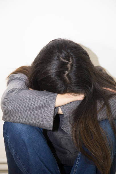 istock Alone and lonely young girl feeling depressed. 917431586