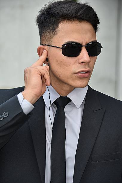 istock Unemotional Diverse Security Guard Wearing Sunglasses 917431808