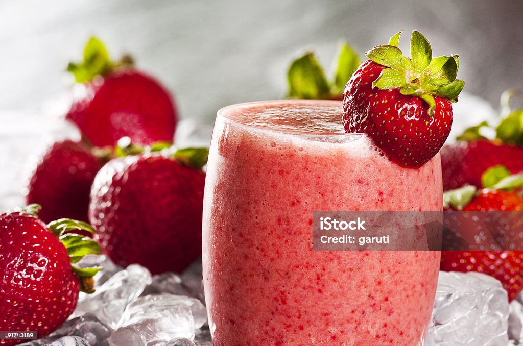 strawberries glass of freshly made strawberry smoothie Color Image Stock Photo