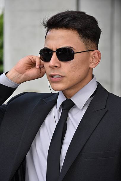istock Unemotional Handsome Security Guard Wearing Sunglasses 917432082
