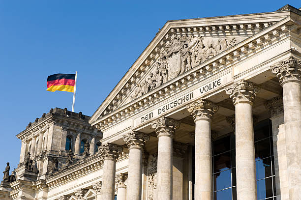 Berlin Reichstag with german flags stock photo