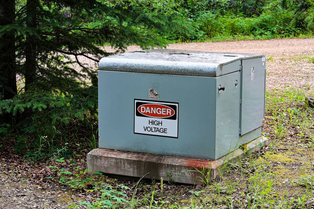 A danger high voltage sign on an electrical box A danger high voltage sign on an electrical box. transformer stock pictures, royalty-free photos & images