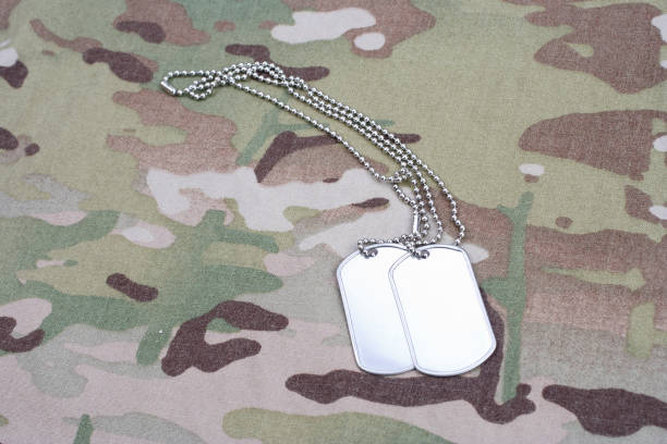 istock dog tag on multicam camouflage uniform 917444472