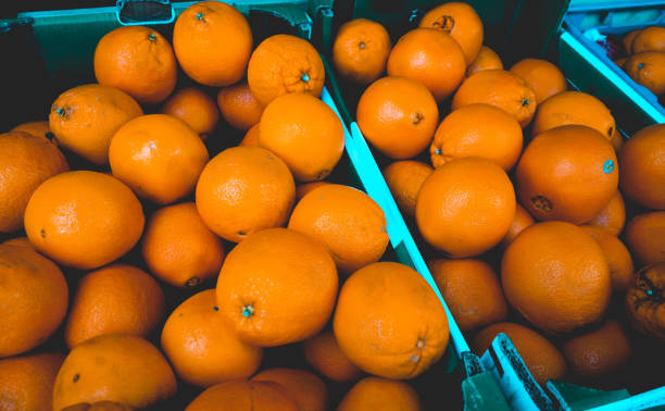 istock orange fruits in a green box 917444690