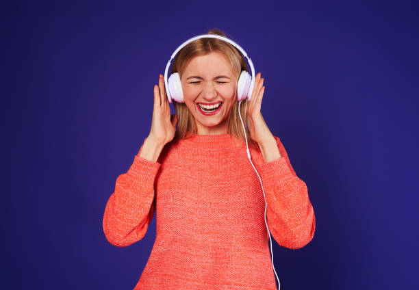 istock funny blond in headphones 917445282