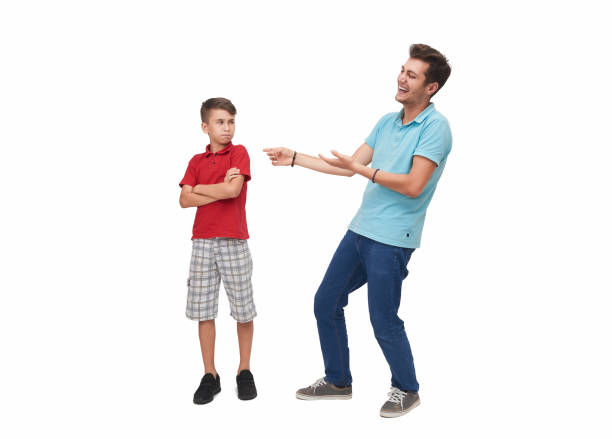 Single grandfather latino and grandchild play and have fun together spending quality family time on Father's Day celebrating victory with hugs and kisses
