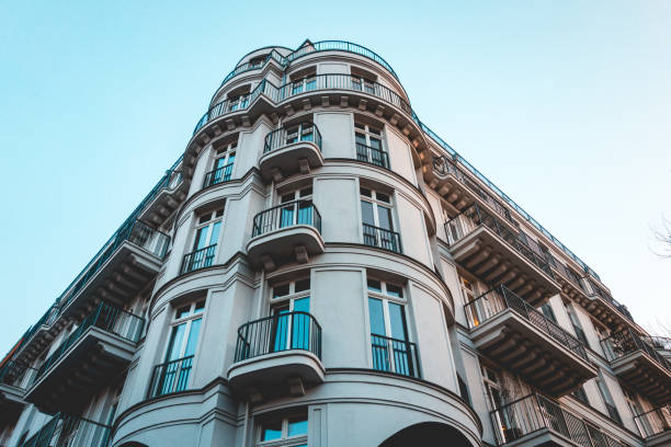 istock luxury corner building with curved facade in low angle view 917450534