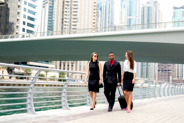 istock Three people heading to meeting walking down street discussing plans 917451822