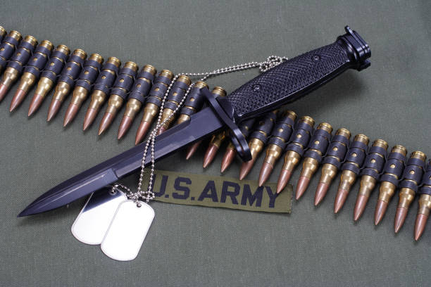 istock bayonet and ammunition belt on US ARMY uniform background 917455676
