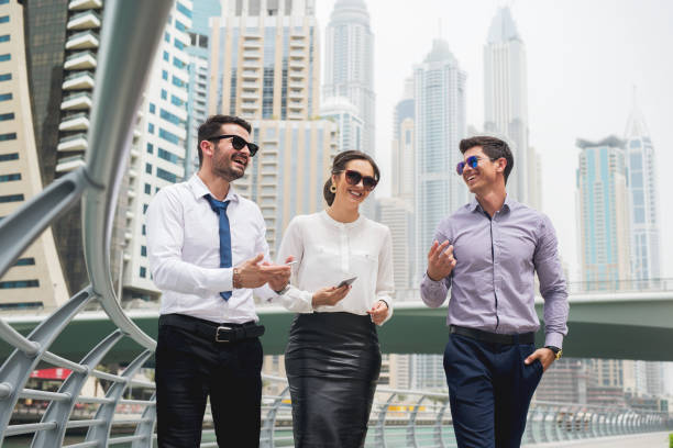 istock Group of business people walking talking. 917458234
