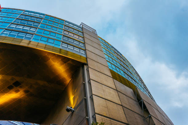 istock futuristic curved finance building from the low angle view 917458278