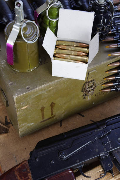 istock army box of ammunition with AK47 rifle and ammunition 917458440