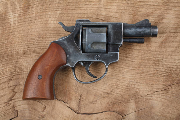 istock Revolver on the wooden table 917458610