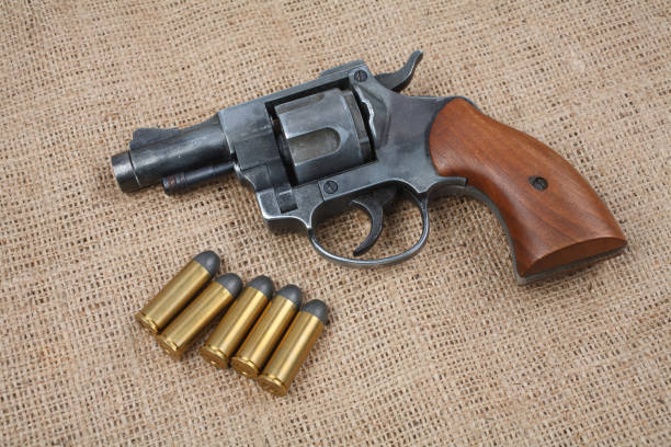 istock Revolver with ammunition on the canvas background 917458776