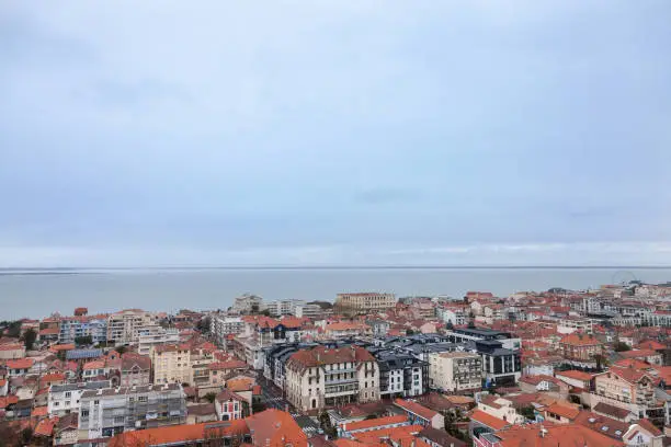 Photo of Aerial view of Arcachon, France, during a storm on a cloudy rainy day. Located in Arachon bay (bassin d'Arachon), the city is one of the most touristic spots of the Atlantic ocean coast in France