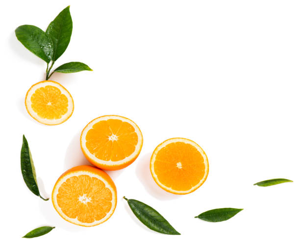 istock Halves of oranges and leaves. 917461780