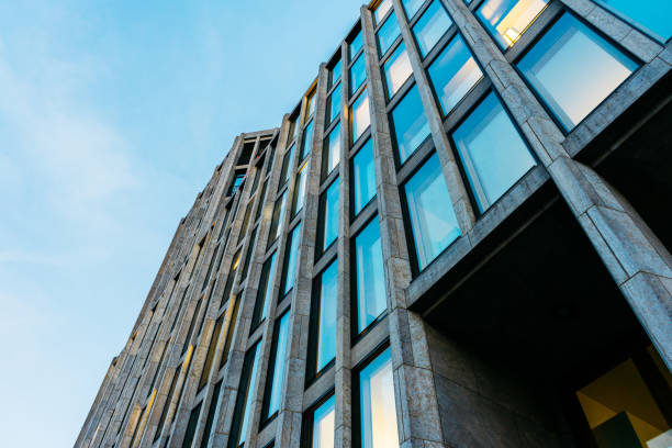 istock low angle view of modern marble building with small and long windows 917462100