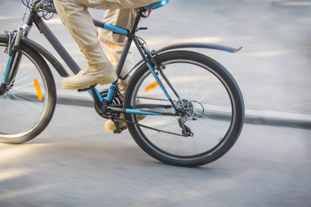 istock cyclist goes by bicycle down street 917462130