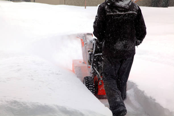 istock Rear View Of Clearing Deep Snow From Residential Driveway 917462426