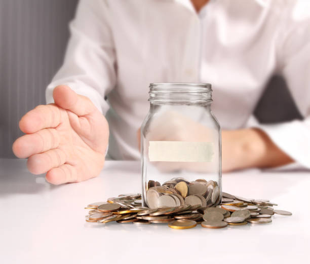 istock glass piggy  bank from  hand 917462564