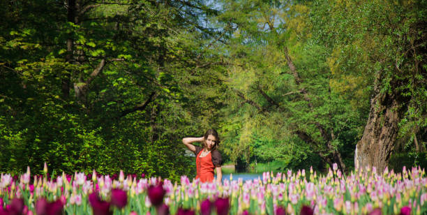 istock woman in Tulip field 917465316