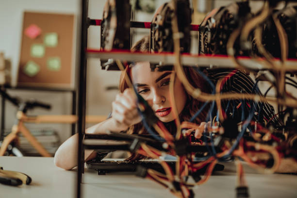 istock Young woman mining bitcoin and other cryptocurrency 917465856