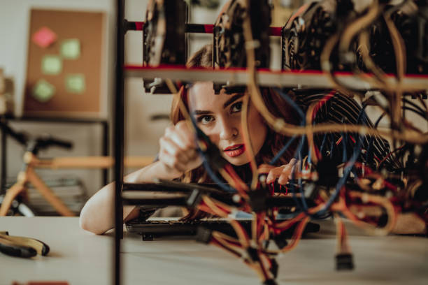 istock Young woman mining bitcoin and other cryptocurrency 917467936