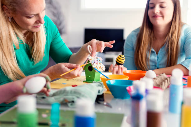 istock Mother and daughter crafting Easter decorations at home. 917471220
