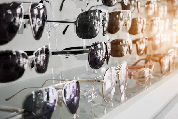 istock Sunglasses on shelves in glasses store 917471474