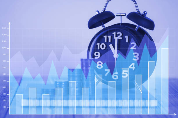 istock Double exposure Steps of coins stack with vintage alarm clock, notebook paper on wooden working table with graph and copy space for text, financial and business planning concept. 917471792