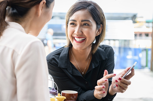 Indonesian businesswoman and colleague on tea break