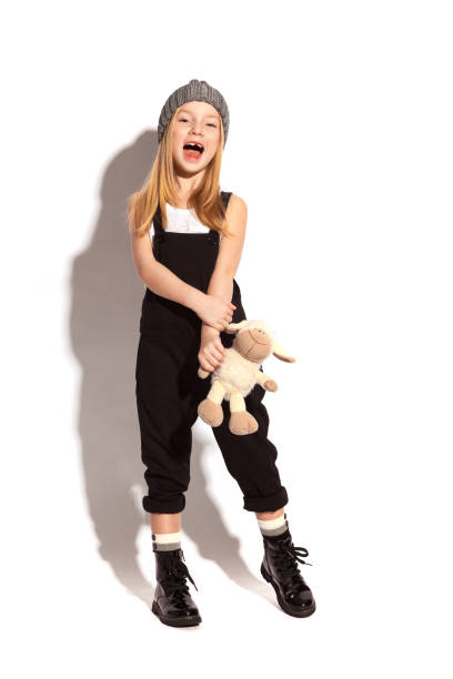 istock a little girl on a white background 917472000