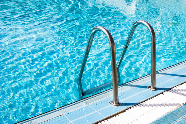 istock Clear transparent pool water and railings 917472248