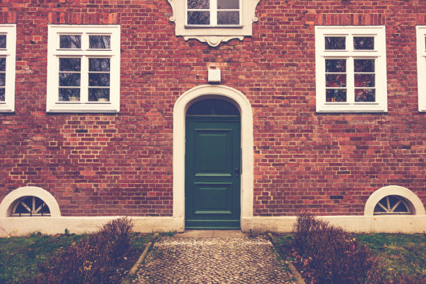 istock green entrance door on brick facade 917475630