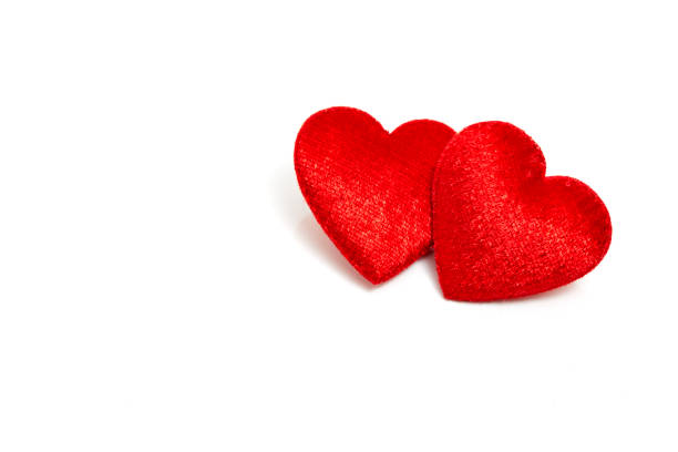 Two Red hearts on white background Red felt hearts isolated on white background felt heart shape small red stock pictures, royalty-free photos & images