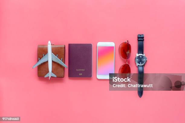 Flat Lay Image Of Accessory Clothing Man Or Women To Plan Travel In Holiday Background Conceptmobile Phone Passport With Many Item In Vacation Seasontable Top View Several Object On Pink Paper Stock Photo - Download Image Now