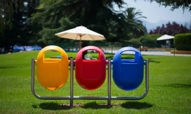 Tricolor wastebins in public park