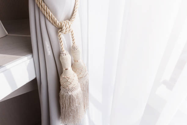 istock white Curtain with Beautiful Sun Light and Shadow 917493202