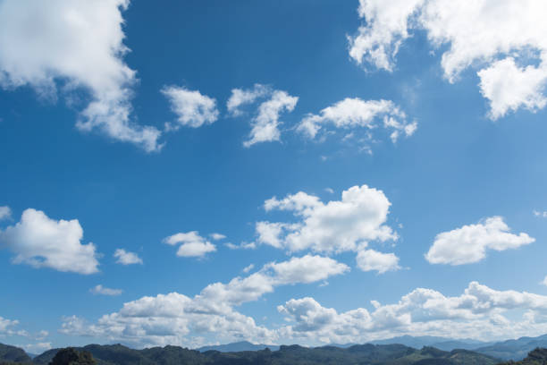 blue sky background with white cumulus clouds the day