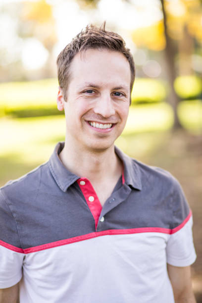 istock Portrait of Attractive Young Man in Park 917499018