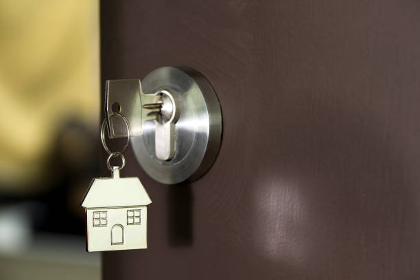 istock House key in a door 917499260