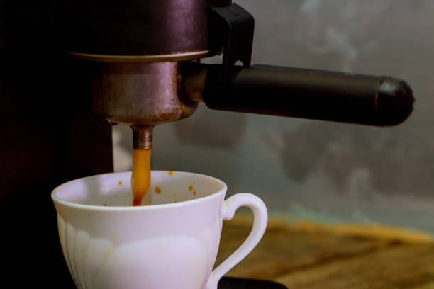 istock Making a coffee cup machine espresso . Process of preparation of coffee 917502788