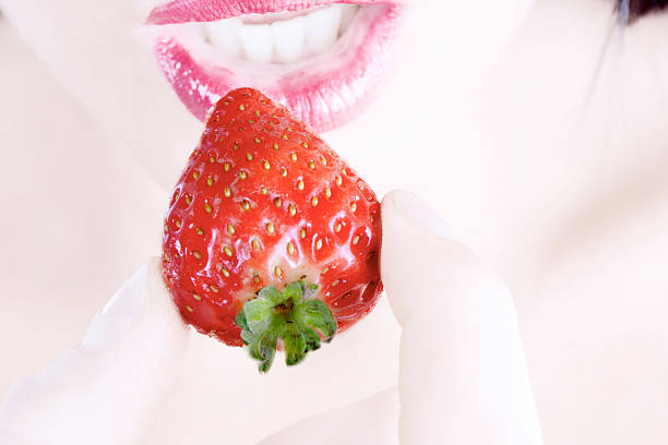istock Woman eating a fresh Strawberry 91750452